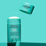 Open Wotnot Natural Zinc Sunscreen Stick SPF 50 on turquoise background