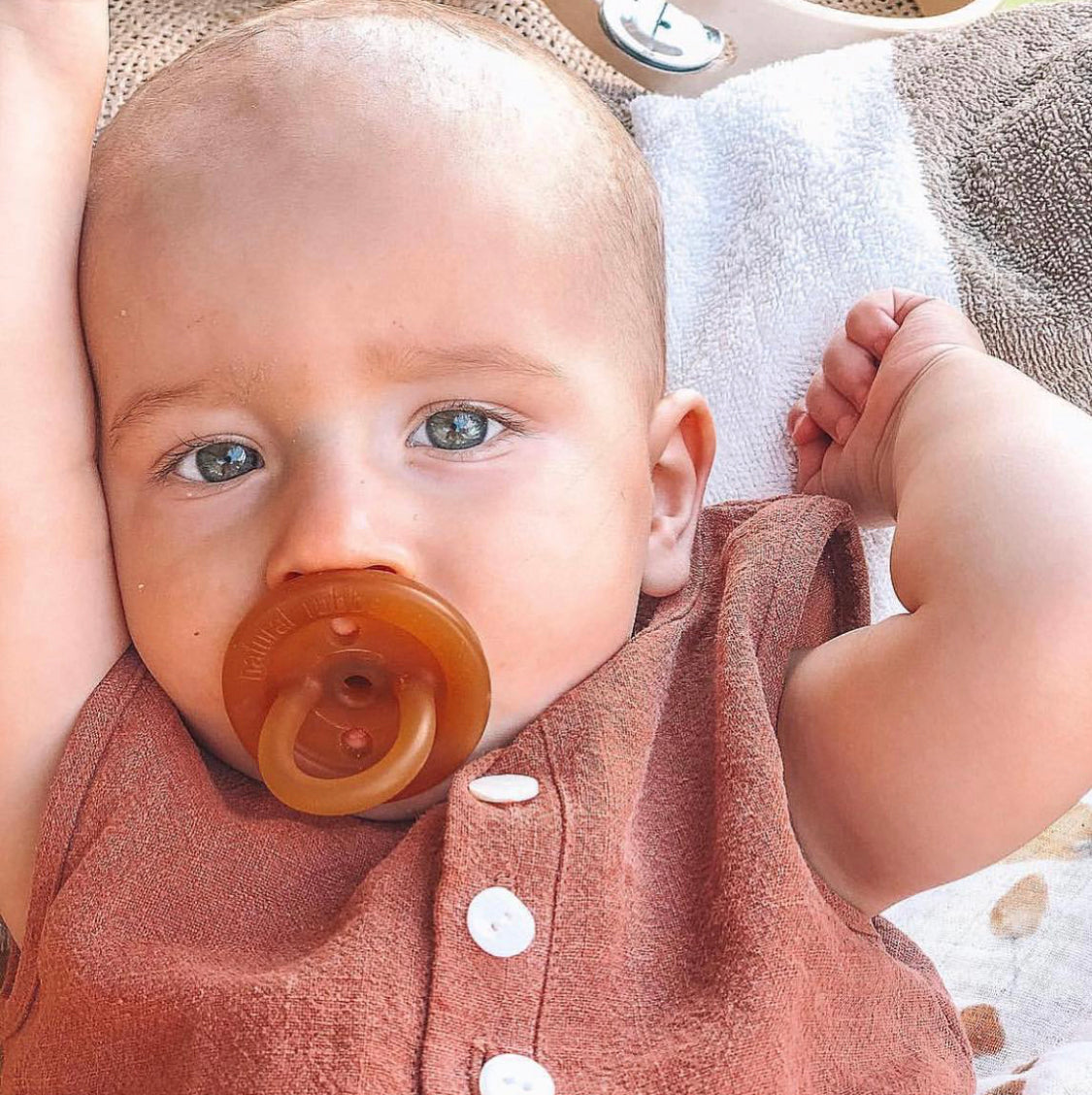 Baby using a Natural Rubber Soother Orthodontic