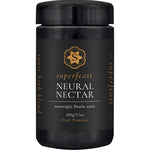 A black container labeled Superfeast Neural Nectar Nootropic Brain Tonic 100g features a gold logo. The label highlights cognitive function and describes it as a tonic herb blend.