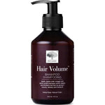 A dark brown pump bottle of New Nordic Hair Volume Shampoo 250ml, with white text and a tree logo. The natural formula highlights apple cider vinegar and amino acids on the label. Contains 8.5 oz (250 ml).