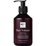 A dark brown pump bottle of New Nordic Hair Volume Shampoo 250ml, with white text and a tree logo. The natural formula highlights apple cider vinegar and amino acids on the label. Contains 8.5 oz (250 ml).