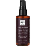 A 75ml brown bottle of New Nordic Hair Volume™ Shine Serum with a black pump, displaying white text and a tree logo on the label.