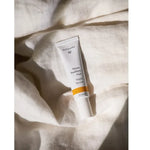 Dr Hauschka Night Serum styled on bed sheets