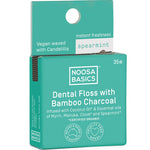 Noosa Basics dental floss packaging with bamboo charcoal and Spearmint on a white background