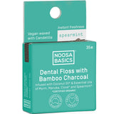 Noosa Basics dental floss packaging with bamboo charcoal and Spearmint on a white background