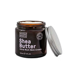 A brown jar of Noosa Basics Ultra Rich Skin Cream - Shea Butter 120ml with a silver lid beside it. The label highlights its preservative-free formula, deep hydration benefits, and 120 mL (4 FL OZ) size of natural skin cream.
