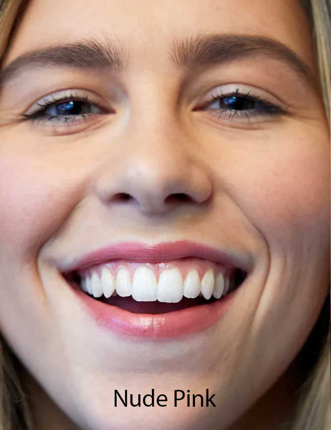 A close-up of a smiling woman with straight white teeth, wearing Luk Beautifood Lip Nourish Lipsticks 3g in nude pink. The text "Nude Pink" appears at the bottom of the image.