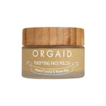 A 56g jar of Orgaid Purifying Face Polish Honey Crystal and Brown Rice, with a wooden lid and beige label, is shown against a plain white background.