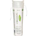Tall transparent drawstring pack of stacked white Organyc cotton pads, wrapped with a white label featuring green lettering and a leaf-shaped emblem.