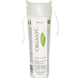 Tall transparent drawstring pack of stacked white Organyc cotton pads, wrapped with a white label featuring green lettering and a leaf-shaped emblem.