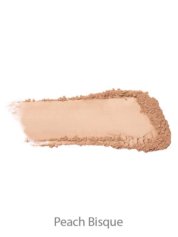 A swatch of 100% Pure Rice Powder Foundation 9g in Peach Bisque, a light peach-beige shade, features a smooth center with loose powder around the edges.