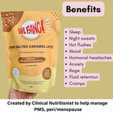 A hand holds She BANG! Peri Salted Caramel Latte 300g, a supplement with magnesium glycinate and collagen peptides for PMS and peri/menopause, supporting better sleep, fewer hot flushes, improved mood, and reduced anxiety.