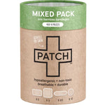 Cylindrical brown cardboard PATCH Mixed Pack bandage tube with a green top band, a large black-outlined cross and small diagrams of four bandage shapes along the bottom.