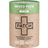 Cylindrical brown cardboard PATCH Mixed Pack bandage tube with a green top band, a large black-outlined cross and small diagrams of four bandage shapes along the bottom.