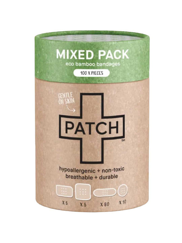 Cylindrical brown cardboard PATCH Mixed Pack bandage tube with a green top band, a large black-outlined cross and small diagrams of four bandage shapes along the bottom.