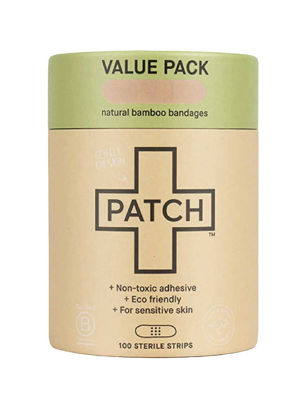 Cylindrical brown cardboard PATCH Natural Bamboo Bandages value-pack tube with a pale green top band and a large black-outlined cross on the front.