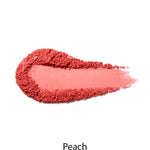 A swatch of 100% Pure Fruit Pigmented® Blush 9g in a peach shade is smudged oval with a trail on white, "Peach" printed below—ideal from 100% Pure for a naturally flushed look.