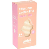 A pink and orange box labeled Pelvi Reusable Cotton Pad Regular, made from 100% cotton. This eco-friendly pad suits moderate flow or light bladder leakage; the box has a texture cutout and icons showing 1 pad inside.