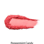 A smear of bright pink powder makeup appears on a white background with "100% Pure Fruit Pigmented® Blush 9g" below—this vegan blush by 100% Pure adds a natural flush to your cheeks.
