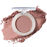 An open compact of 100% Pure Fruit Pigmented® Eye Shadow 2g by 100% Pure reveals matte mauve powder, some scattered nearby, resembling pressed powder blush against a clean white background.