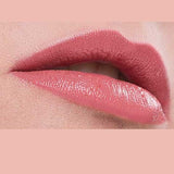 Close-up of lips wearing Benecos Natural Lipsticks 4.5g in a glossy pink shade, hydrating and enhancing your pout. The upper lip gently overlaps the lower, set against a matching pink background for a natural effect.