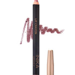 A pink nude INIKA Organic Lip Crayons 6.7g with a gold cap stands upright, a swatch of the shade behind it. This organic lip crayon doubles as a long-lasting liner. Text below says Pink Nude.