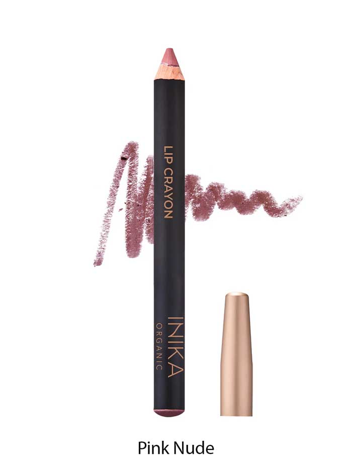 A pink nude INIKA Organic Lip Crayons 6.7g with a gold cap stands upright, a swatch of the shade behind it. This organic lip crayon doubles as a long-lasting liner. Text below says Pink Nude.