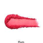 A curved smear of bright plum-hued 100% Pure Fruit Pigmented® Blush 9g is displayed on a white background, with "Plum" written underneath.