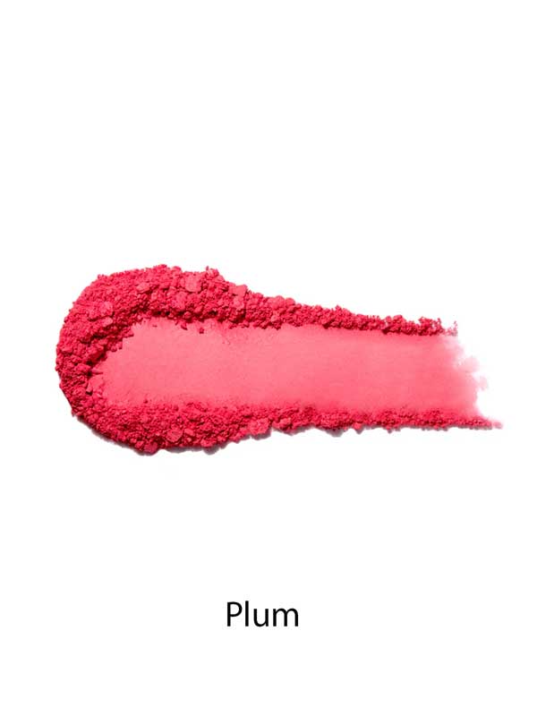 A smear of the 100% Pure Rice Powder Pressed Blush 9g in bright plum appears on a white background, with "Plum" below, showcasing its natural flush and buildable coverage.