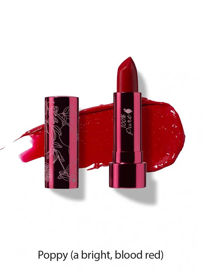 A tube of 100% Pure Pomegranate Oil Moisturising Lipstick 4.5g is shown in a floral-patterned metallic case, with a swatch of bright blood-red shade behind it. The shade is labeled Poppy (a bright, blood red).