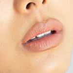 Close-up of lips wearing Ere Perez Acai Lip Pencil in a soft hazel shade, paired with hydrating lipstick for a flawless finish. Smooth, natural skin visible. The words "shade pout | soft hazel" appear at the bottom of the image.