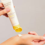 The Jojoba Company Australian Jojoba Hand Cream tube with a dab of cream