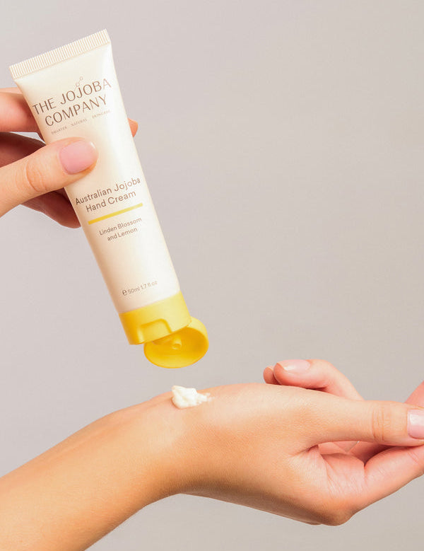 The Jojoba Company Australian Jojoba Hand Cream tube with a dab of cream