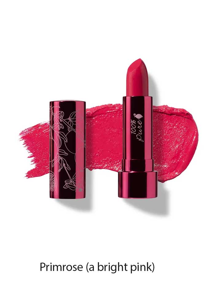 A bright pink, moisturising lipstick with a dark metallic case is shown upright beside its cap and a pink smear. Text below: Primrose (a bright pink) 100% Pure Pomegranate Oil Moisturising Lipstick 4.5g.