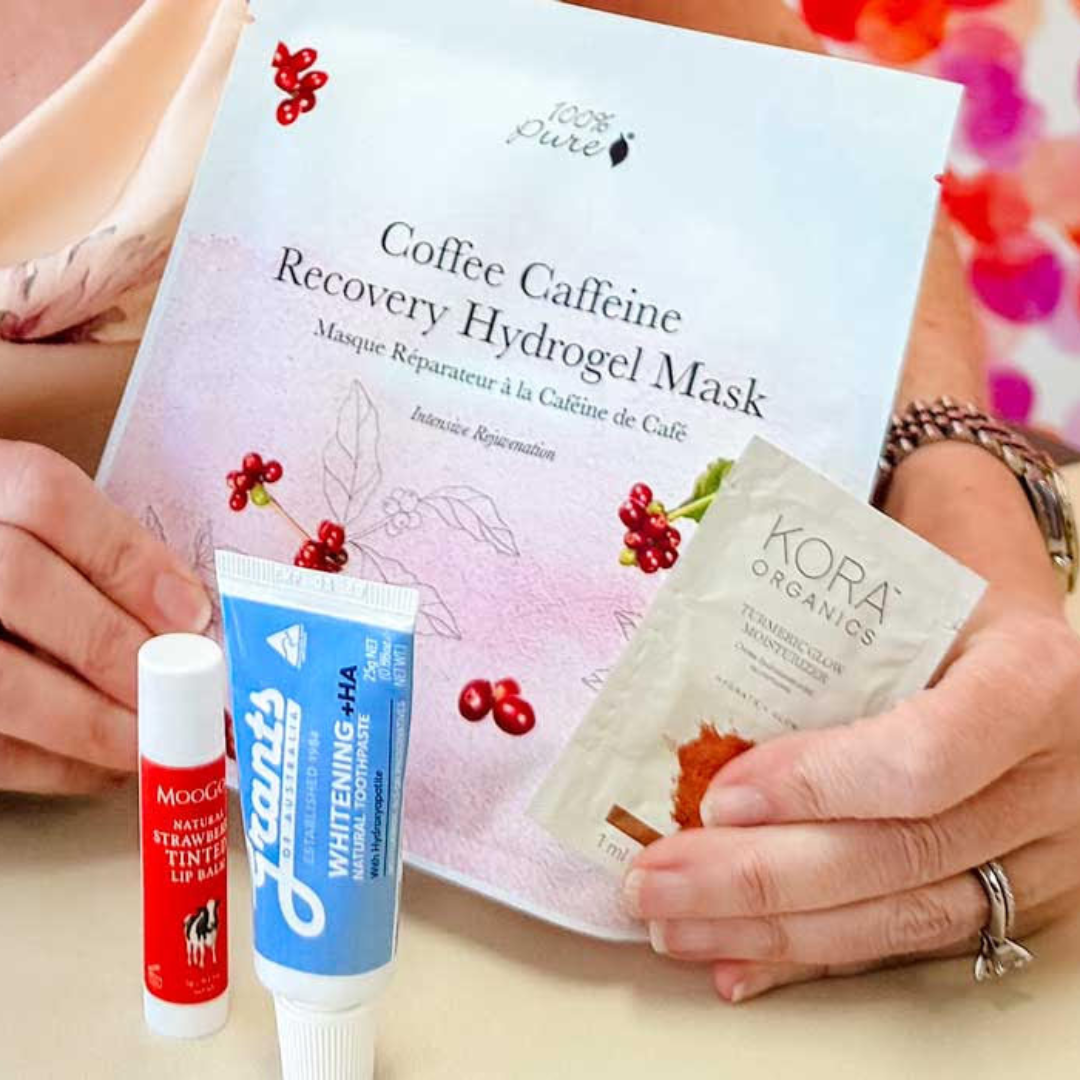 A person holds a FREE Sample Box with orders $149+ from Clean Nectarine, their hands resting on a table.