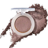 An open compact of 100% Pure Fruit Pigmented® Eye Shadow 2g by 100% Pure reveals shimmery taupe pressed powder, with loose vegan pigment scattered below to showcase its color and texture.