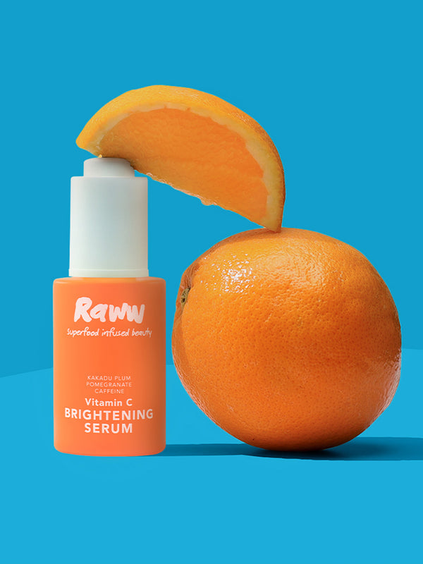 Model applying Raww Vitamin C Brightening Serum