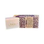 Cream rectangular Radico Lavender shampoo bar embossed with the Radico name, partly slid out of an open brown carton patterned with purple and cream leafy vines.