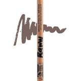 The Raww Babassu Oil Brow Fix 1.1g is shown vertically with a brown swatch behind it, highlighting the soft cocoa shade and texture for fuller-looking brows.