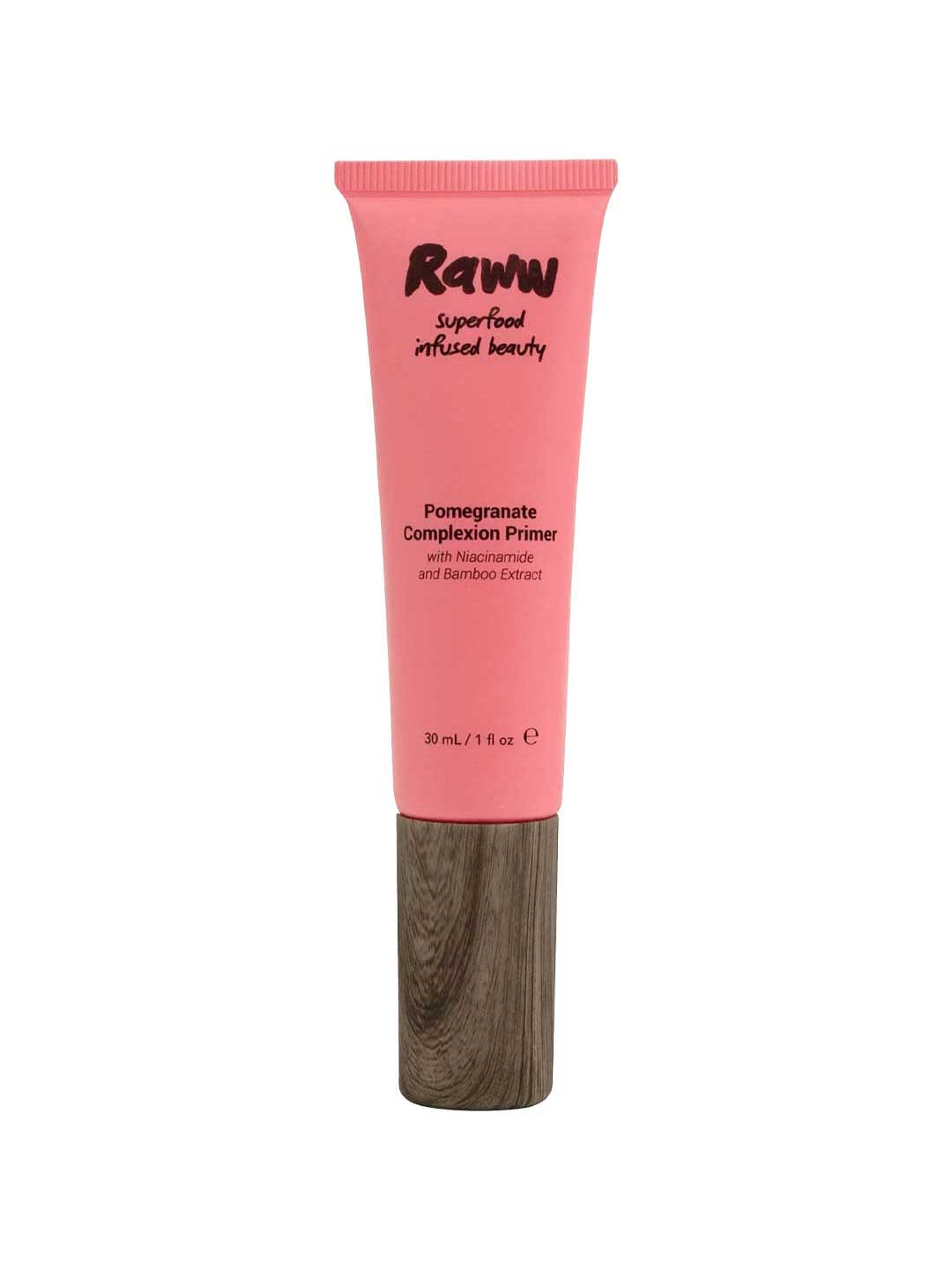 A pink tube of Raww Pomegranate Complexion Primer 30ml with a brown cap. This natural primer features niacinamide, bamboo extract, and supports long-lasting makeup. Contains 30 mL (1 fl oz).