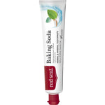 Slender white Red Seal Baking Soda toothpaste tube standing on a small red cap, with large black lettering, a red logo panel and mint leaves near the top.