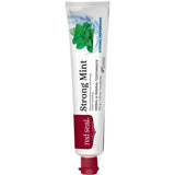 Slender white Red Seal Strong Mint toothpaste tube standing on a small red cap, with a red logo panel, black lettering and a cluster of green mint leaves near the top.