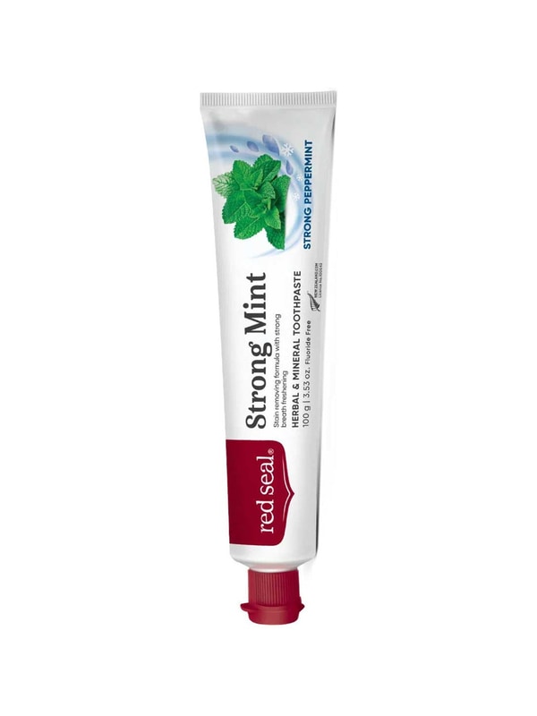 Slender white Red Seal Strong Mint toothpaste tube standing on a small red cap, with a red logo panel, black lettering and a cluster of green mint leaves near the top.