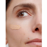Applying Dr Hauschka Regenerating Day Cream Complexion
