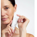 Model holding Dr Hauschka Regenerating Day Cream