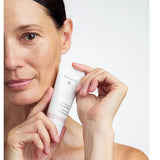 Model holding Dr Hauschka Regenerating Day Cream
