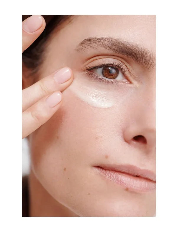 Model applying Dr Hauschka Regenerating Eye Cream