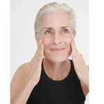 Model applying Dr Hauschka Regenerating Night Serum Intensive