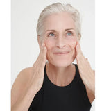 Model applying Dr Hauschka Regenerating Night Serum Intensive