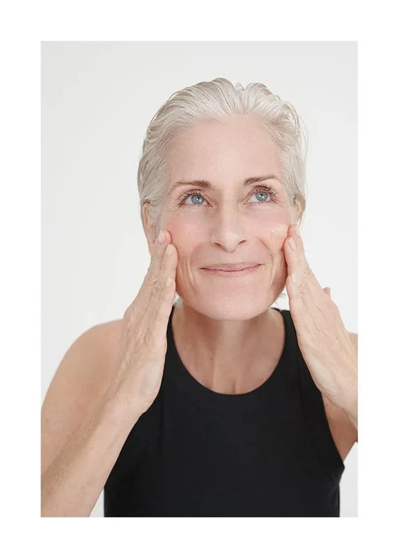 Model applying Dr Hauschka Regenerating Night Serum Intensive